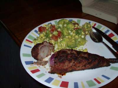 Finished Meal: Meat-wrapped onions and fresh corn, avocado, and tomato salad