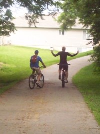 Tim and John on bicycles