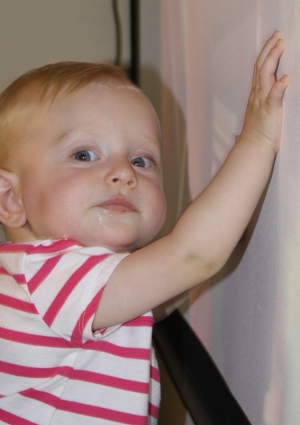 Little Miss touches projector screen