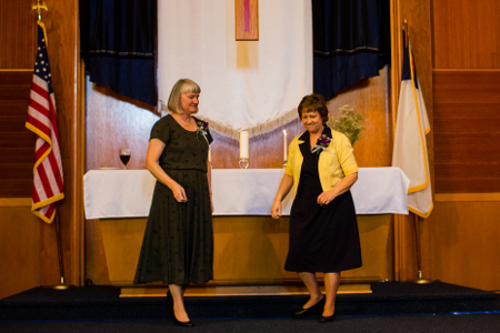 My mother and mother in law lighting the unity candle