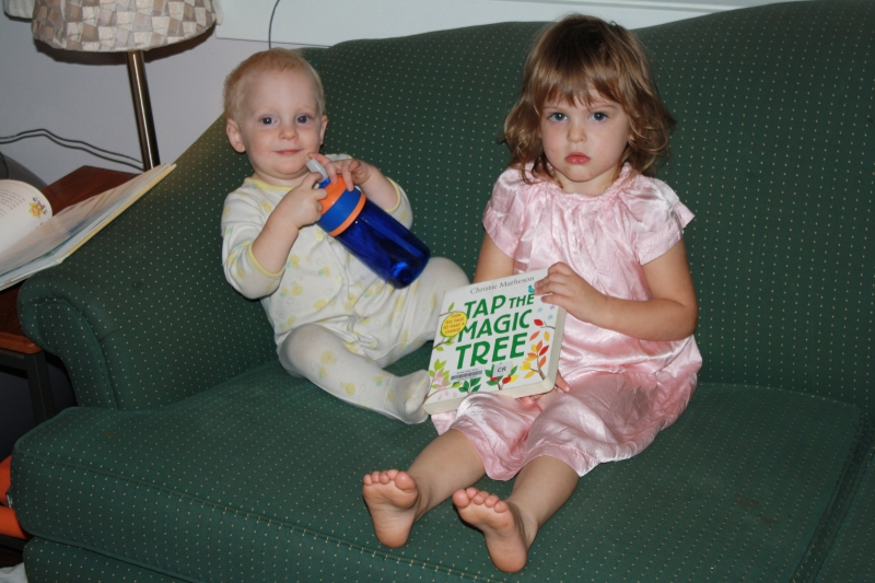 Tirzah Mae and Louis read "Tap the Magic Tree"