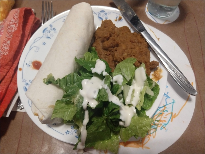 Salsa chicken burrito, non-refried beans, and lettuce salad