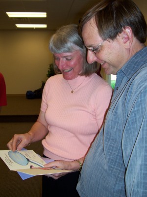 Mom and Dad looking at a card